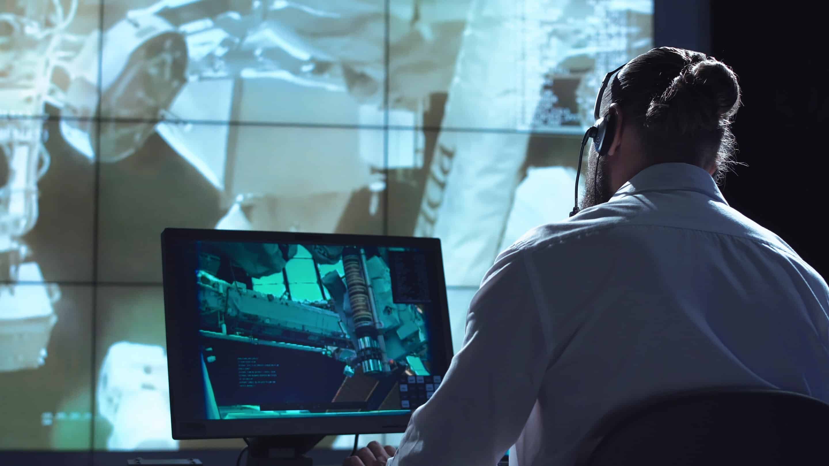 Movement,Shot,Back,View,Of,Man,Working,On,Space,Mission